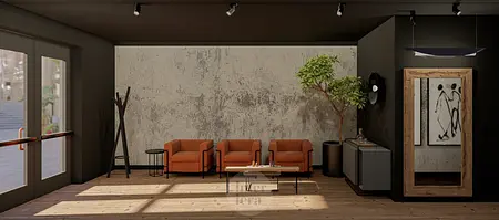 Wnętrze w stylu eklektycznym z pomarańczowymi fotelami, drewnianym stołem i industrialnymi akcentami.