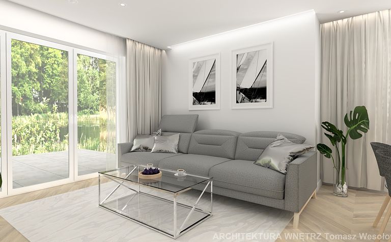 Nowoczesny salon z szarym narożnikiem, szklanym stolikiem i roślinami, minimalistyczny design.