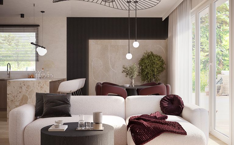 Nowoczesny salon z białą sofą, czarnym stolikiem i roślinami