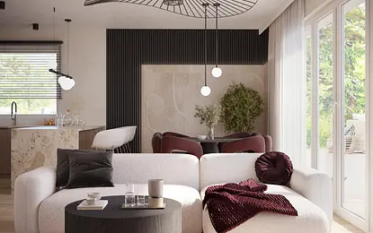 Nowoczesny salon z białą sofą, czarnym stolikiem i roślinami