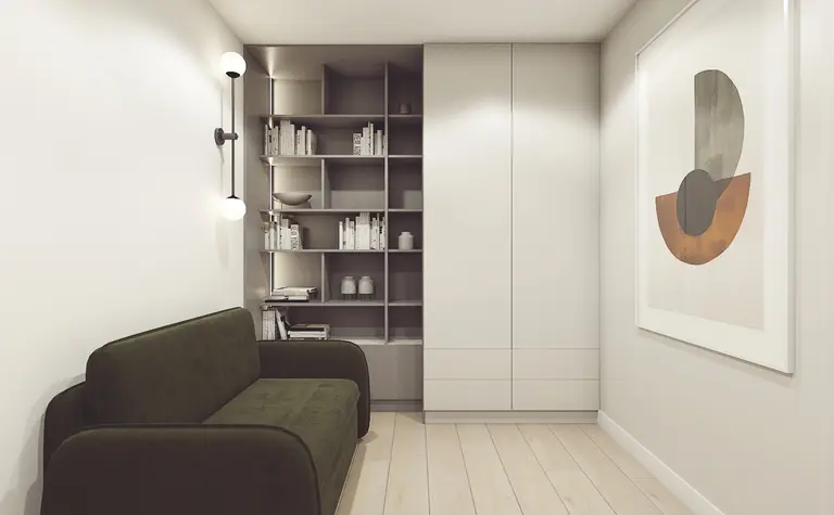 Wnętrze pokoju z zieloną sofą, nowoczesnymi regałami i minimalistycznymi detalami.