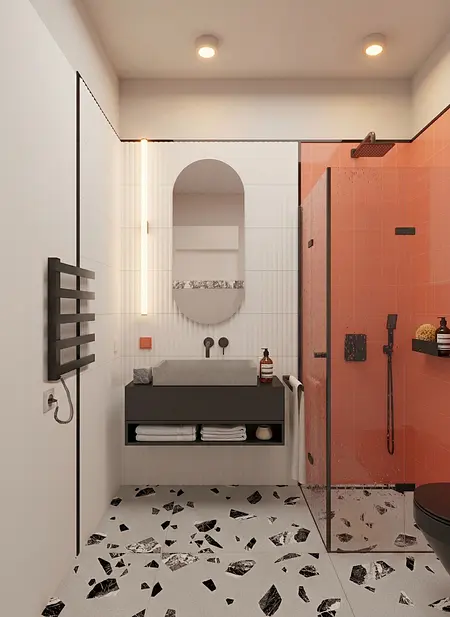 Wnętrze łazienki z industrialnym i minimalistycznym stylem, szarym blatem, pomarańczowymi płytkami.