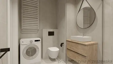 Wnętrze łazienki z pralką, drewnianą szafką i lustrem. Styl industrialny, minimalistyczny, współczesny.