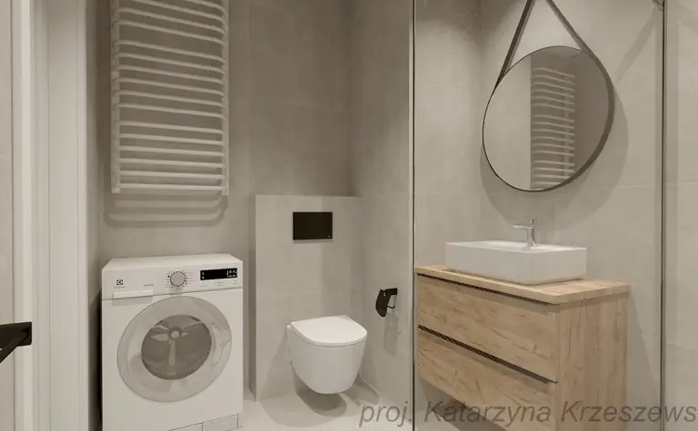 Wnętrze łazienki z pralką, drewnianą szafką i lustrem. Styl industrialny, minimalistyczny, współczesny.