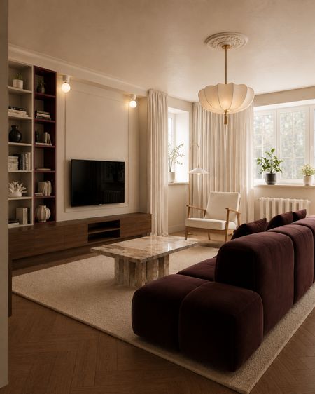 Wnętrze salonu w stylu art deco z brązową sofą i nowoczesnym oświetleniem.