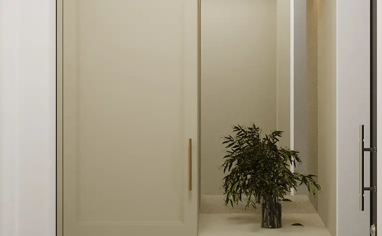 Przedpokój w stylu boho, eklektycznym i glamour z beżowymi meblami i rośliną.