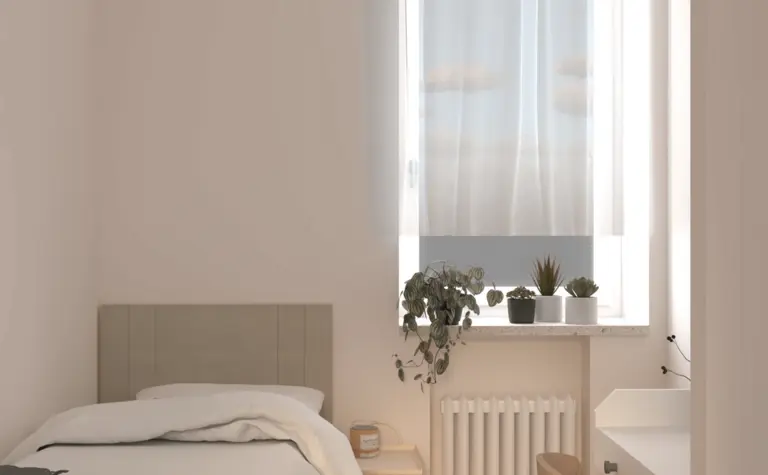 Minimialistyczna sypialnia z nowoczesnym oświetleniem i roślinnością.