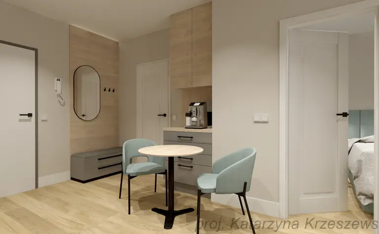 Wnętrze w stylu industrialnym i minimalistycznym z małym stołem i krzesłami.
