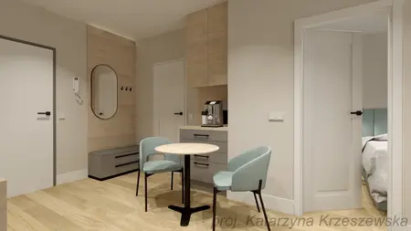 Wnętrze w stylu industrialnym i minimalistycznym z małym stołem i krzesłami.