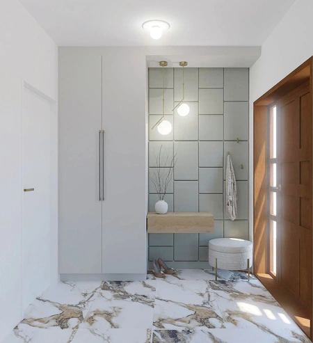 Przedpokój z szarymi płytkami, drewnianymi elementami i minimalistycznym wystrojem w stylu quiet luxury.