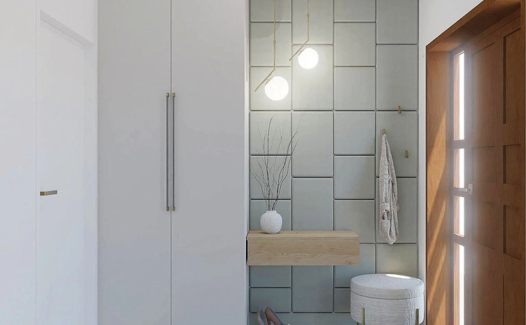 Przedpokój z szarymi płytkami, drewnianymi elementami i minimalistycznym wystrojem w stylu quiet luxury.