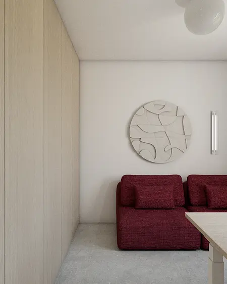 Wnętrze pokoju dziennego w stylu eklektycznym i minimalistycznym z czerwonymi meblami.