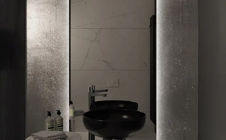 Nowoczesna łazienka z czarną umywalką, białymi kafelkami i minimalistycznym designem.