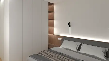 Sypialnia w stylu industrialnym i minimalistycznym z szarym łóżkiem i białymi ścianami.