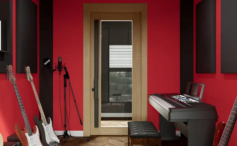 Wnętrze eklektycznego pokoju do nagrywania z czerwonymi ścianami i instrumentami muzycznymi.