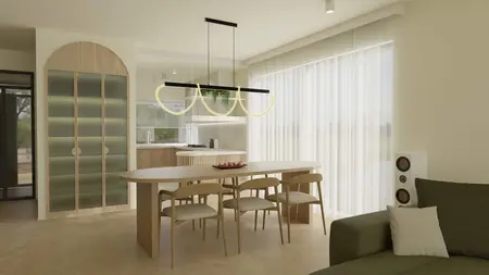 Jasna jadalnia z owalnym stołem drewnianym, czterema krzesłami, designerską lampą sufitową w kształcie pętli oraz szafą o zaokrąglonych drzwiach.