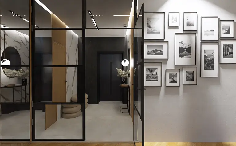 Przedpokój w stylu japandi, minimalistycznym i nowoczesnym z czarnymi detalami.
