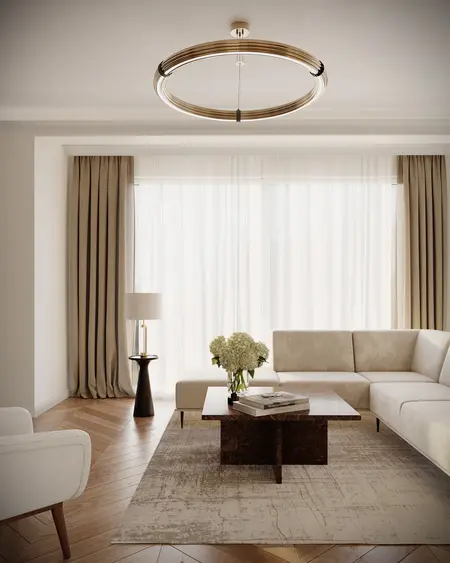 Wnętrze salonu w stylu quiet luxury i współczesnym, z jasnymi meblami i drewnianą podłogą.
