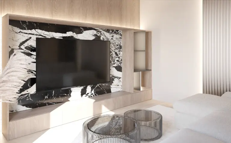 Wnętrze salonu w stylu japandi z minimalistycznym wystrojem i nowoczesnym telewizorem.