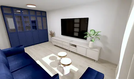 Współczesny salon z niebieską sofą, białymi meblami i rośliną.