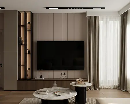 Nowoczesny salon z telewizorem, jasnymi meblami i minimalistycznym wystrojem.