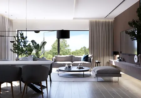 Wnętrze nowoczesnego salonu z dużymi oknami, jasnymi meblami i roślinami.