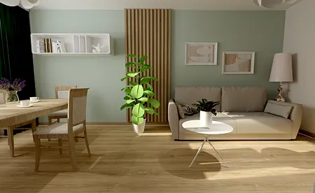 Nowoczesny salon z jasnymi meblami i dużą rośliną w donicy.