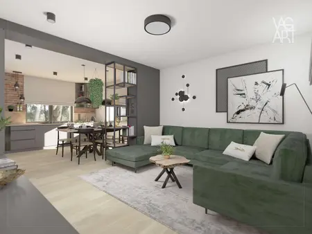 Wnętrze salonu w stylu industrialnym z zieloną sofą i drewnianym stołem.