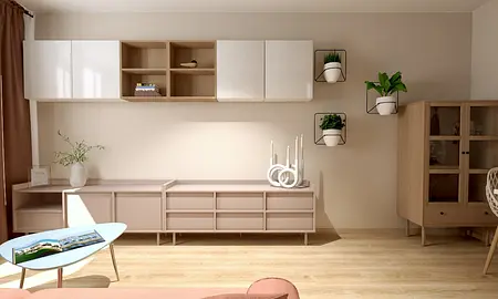 Wnętrze salonu z drewnianymi meblami, białymi szafkami i roślinami w doniczkach.