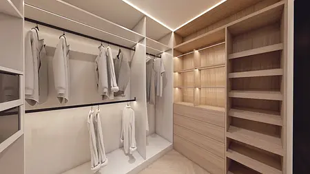 Garderoba w stylu minimaluxe z białymi ubraniami i drewnianymi elementami.