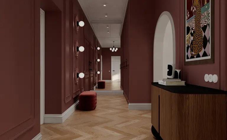 Przedpokój w stylu art deco z różowymi ścianami i drewnianą podłogą, minimalistyczne oświetlenie.