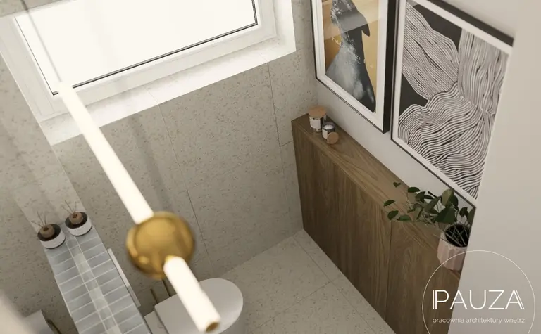 Nowoczesna łazienka z drewnianymi akcentami i grafikami.