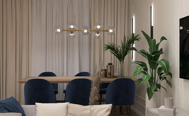 Nowoczesny salon z niebieskimi fotelami, jasnymi zasłonami i rośliną doniczkową.