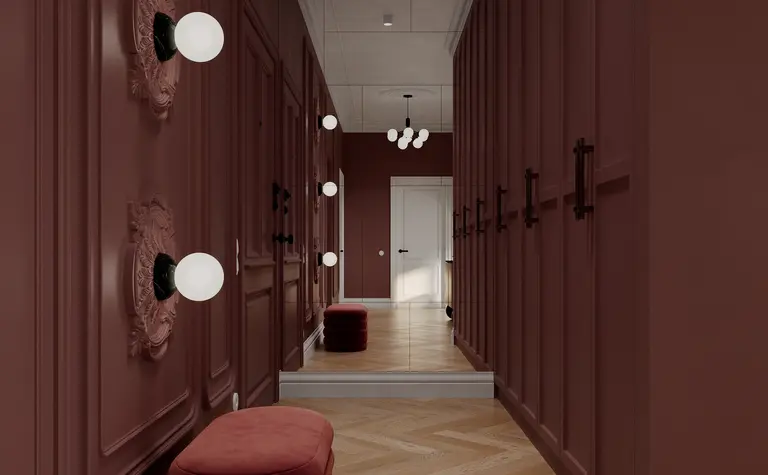 Przedpokój w stylu art deco z lampami, lustrem i drewnianą podłogą.