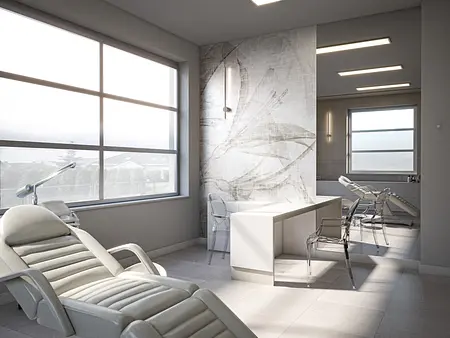 Gabinet z białymi fotelami, minimalistyczny design, nowoczesne oświetlenie.