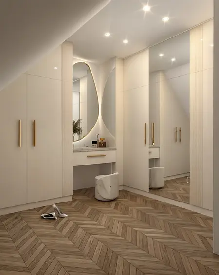 Garderoba w stylu glamour i minimaluxe z drewnianą podłogą i dużymi lustrami.