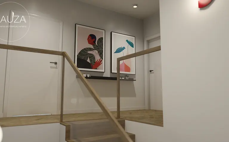Korytarz z drewnianymi schodami i nowoczesnymi obrazami w stylu vintage.