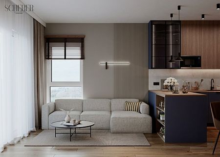 Wnętrze salonu w stylu japandi i współczesnym z szarym narożnikiem i drewnianymi akcentami.