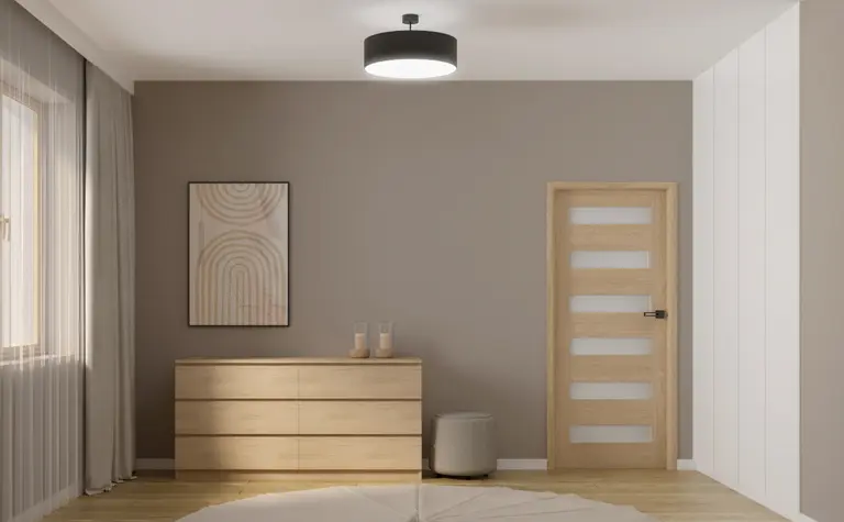 Wnętrze minimalistyczne w stylu japandi z drewnianą komodą i szarymi ścianami