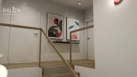 Korytarz z drewnianymi schodami i nowoczesnymi obrazami w stylu vintage.