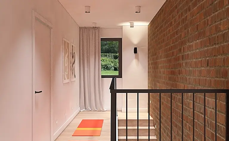 Przedpokój w stylu minimalistycznym z ceglaną ścianą, białymi elementami i drewnianą podłogą