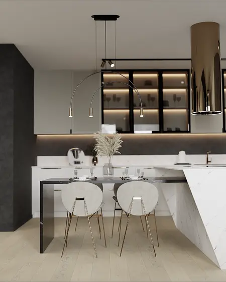 Nowoczesna kuchnia z białym blatem, czarnymi meblami i eleganckim oświetleniem.