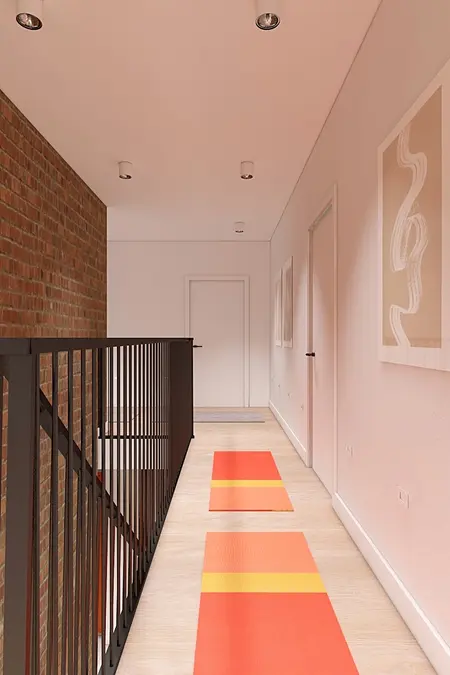 Przedpokój w stylu minimalistycznym z ceglaną ścianą, nowoczesnymi lampami i kolorowymi dywanami.