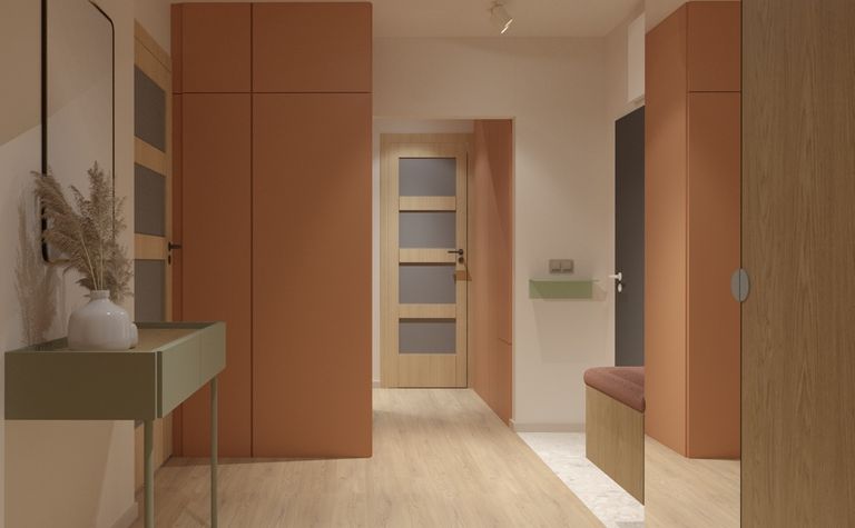 Przedpokój z pomarańczowymi szafami, zielonymi detalami i stylowym wystrojem dopamine decor.
