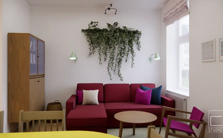 Wnętrze salonu z czerwonymi meblami, drewnianym stołem i roślinnością. Styl dopamine decor, eklektyczny, skandynawski.