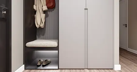 Przedpokój z minimalistycznym designem, w stylu minimaluxe, z szarymi meblami i drewnianą podłogą.