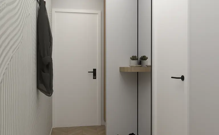 Nowoczesny przedpokój z minimalistycznymi akcentami i drewnianą podłogą.