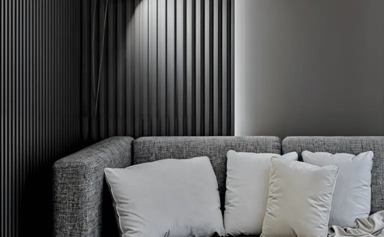 Wnętrze nowoczesnego salonu z minimalistycznym narożnikiem i oświetleniem w stylu skandynawskim.