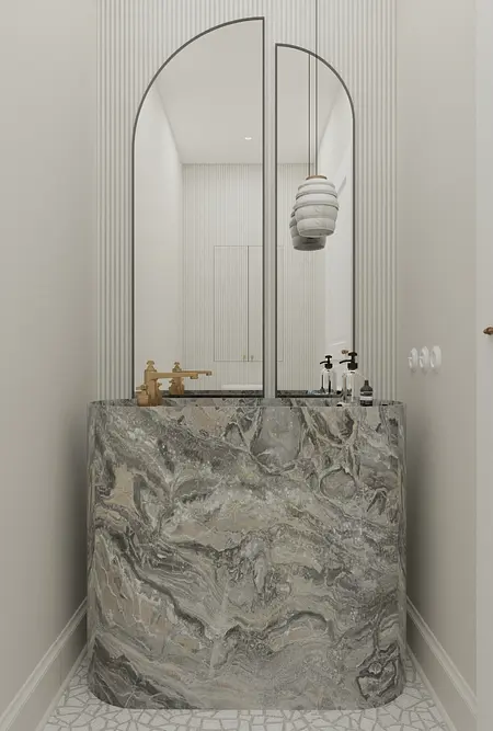 Wnętrze łazienki z marmurową umywalką i lustrami w stylu art deco i minimaluxe.