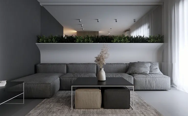 Wnętrze salonu w stylu eklektycznym i minimalistycznym z szarym narożnikiem i roślinami.